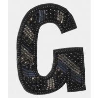 Broche G-*