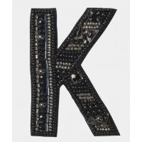 Broche K-*